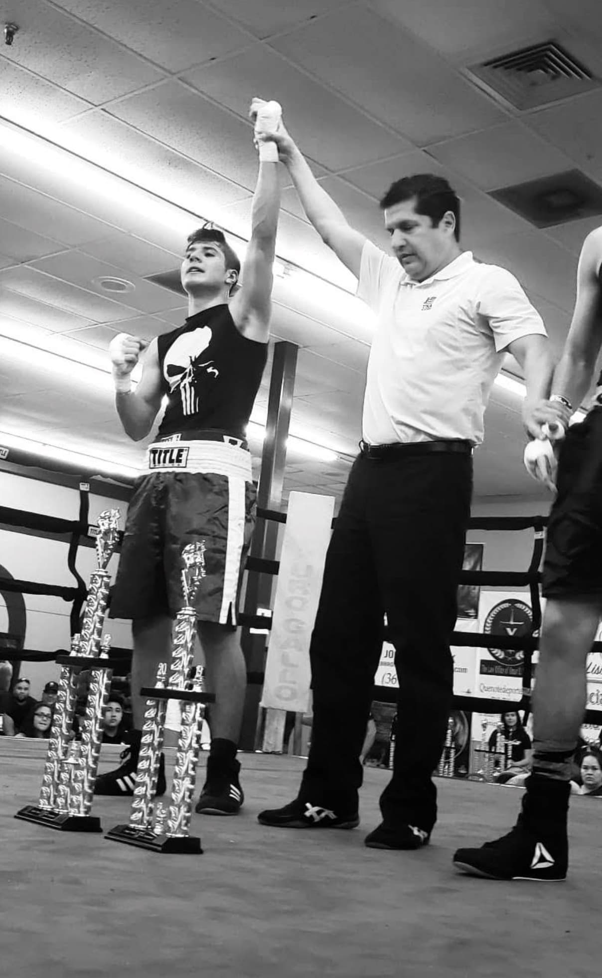 Hand raised after a win